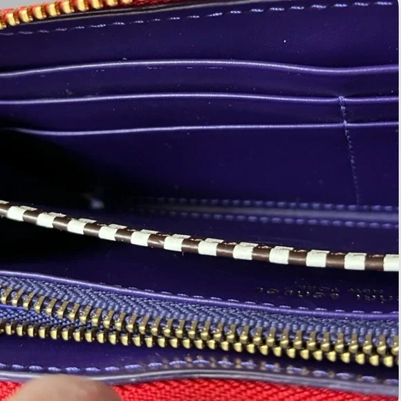 Henri Bendel red quilted wallet with a gold-tone logo. - Picture 13 of 16